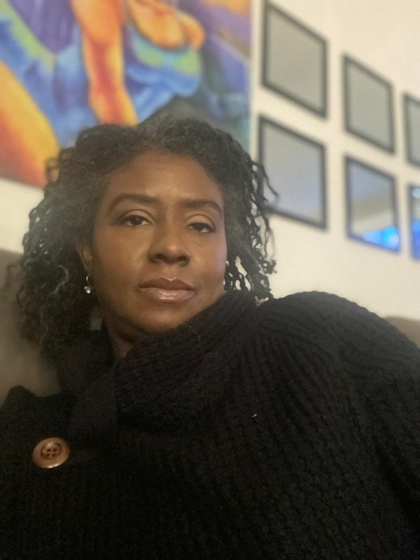 Studio workspace with easel, pigments, and works in progress